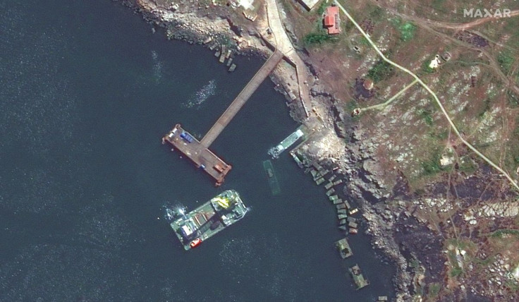 A satellite image shows a closer view of a barge, a Serna-class landing craft and a sunken Serna craft in Snake Island, Ukraine May 12, 2022. Satellite image 2022 Maxar Technologies/Handout via REUTERS 