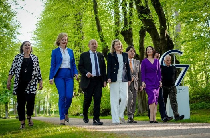 G7 countries foreign ministers walk for dinner during their summit in Weissenhaeuser Strand, Germany May 12, 2022. Foreign ministers pictured: Elizabeth Truss of Britain, Jean-Yves Le Drian of France, Melanie Joly of Canada, Annalena Baerbock of Germany, 