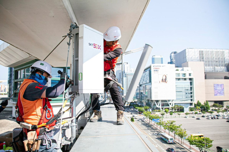 Engineers set up a 5G base station in Seoul, South Korea, May 31, 2019, in this handout picture provided by SK Telecom. Picture taken May 31, 2019. SK Telecom/Handout via