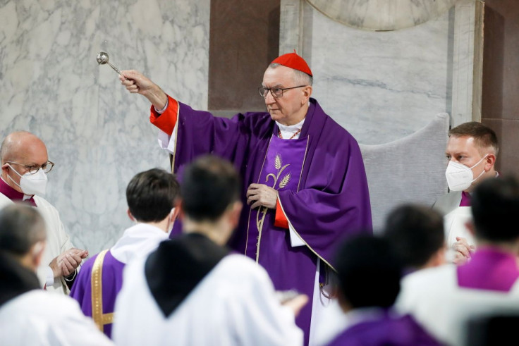 Vatican's Secretary of State Cardinal Pietro Parolin sprinkles holy water during a mass on Ash Wednesday, in Rome, Italy, March 2, 2022.
