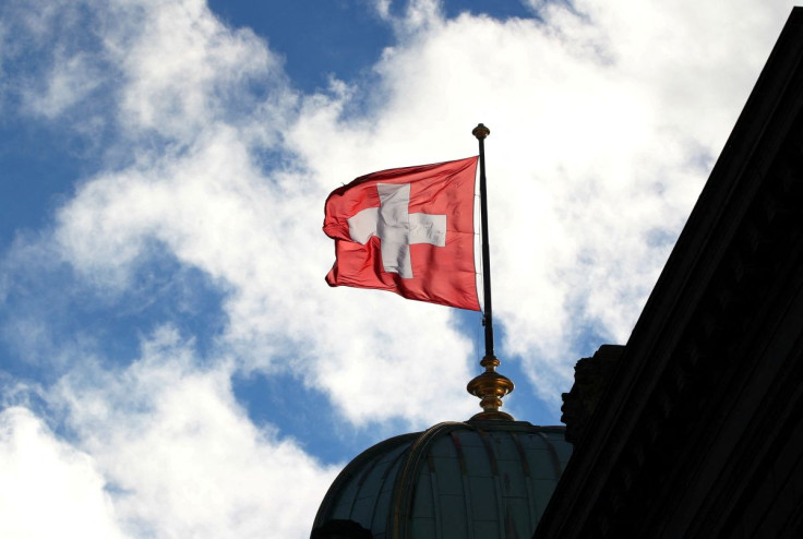 A Swiss flag is pictured on the Federal Palace (Bundeshaus) in Bern, Switzerland December 7, 2018. Picture taken December 7, 2018.