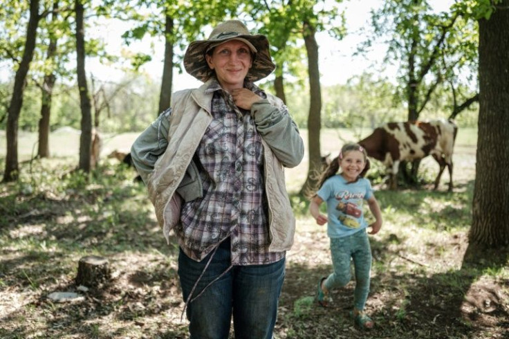 'Our cows have started to ignore it,' milkmaid Lyudmyla says of the fighting encircling her east Ukrainian town