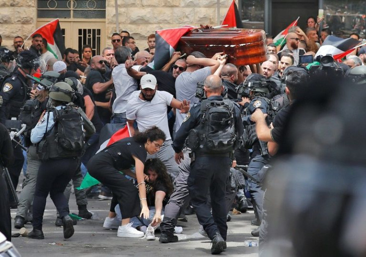 Violence erupts between Israeli security forces and Palestinian pallbearers carrying the casket of slain Al-Jazeera journalist Shireen Abu Akleh