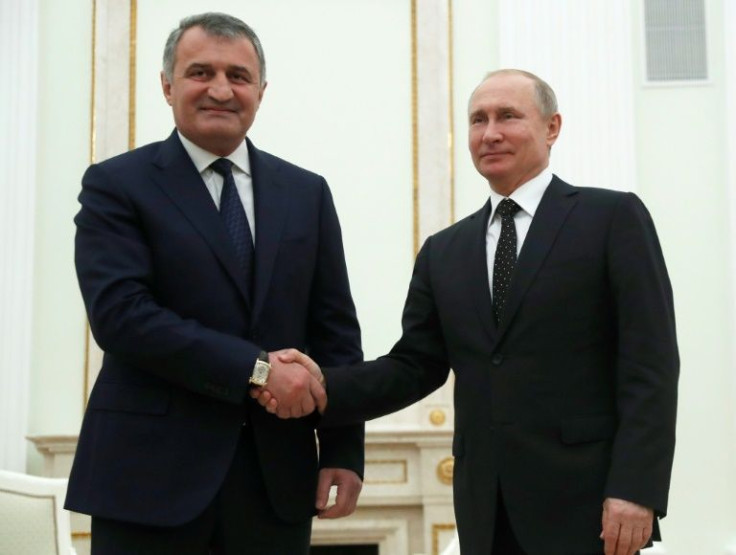 Anatoly Bibilov (L), the leader of Georgia's breakaway region of South Ossetia, seen here at a meeting with Russian President Vladimir Putin (R) on March 6, 2019