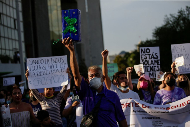 Gerardo Martinez, father of Yolanda Martinez, a 26-year-old woman who disappeared on March 31, walks while holding up a birthday present for his granddaughter, Yolanda's daughter, during a protest, in Monterrey, Mexico April 29, 2022. 