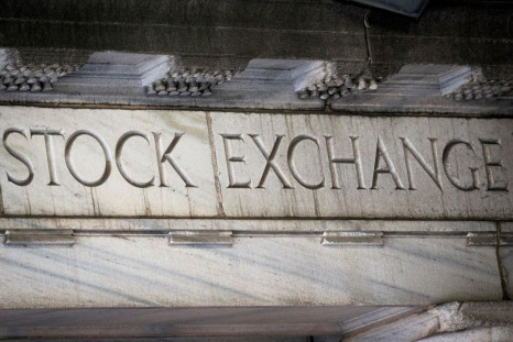 "Stock Exchange" is seen over an entrance to the New York Stock Exchange (NYSE) on Wall St. in New York City, U.S., March 29, 2021.  