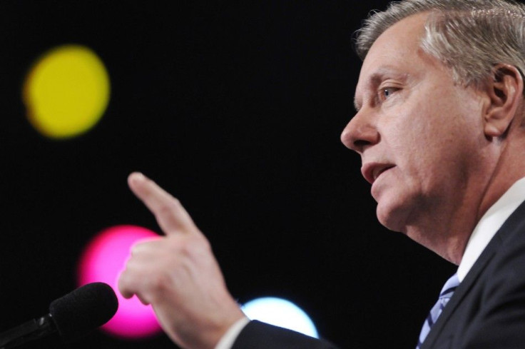 US Senator Graham points as he addresses the gala banquet of the AIPAC annual policy conference in Washington