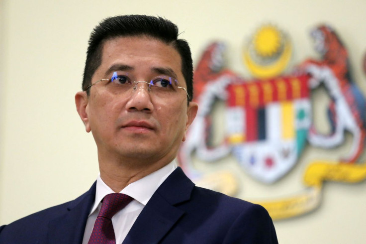 Malaysia's Minister of International Trade and Industry Azmin Ali reacts during a news conference in Putrajaya, Malaysia March 11, 2020. 