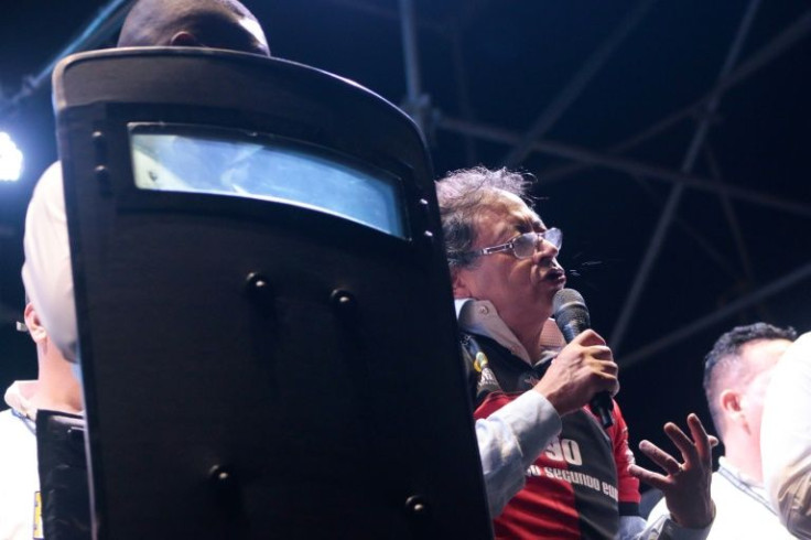 Leftist presidential candidate Gustavo Petro, wearing a bullet proof vest and surrounded by bodyguards, speaks at a campaign rallly in Cucuta, Colombia on May 5, 2022