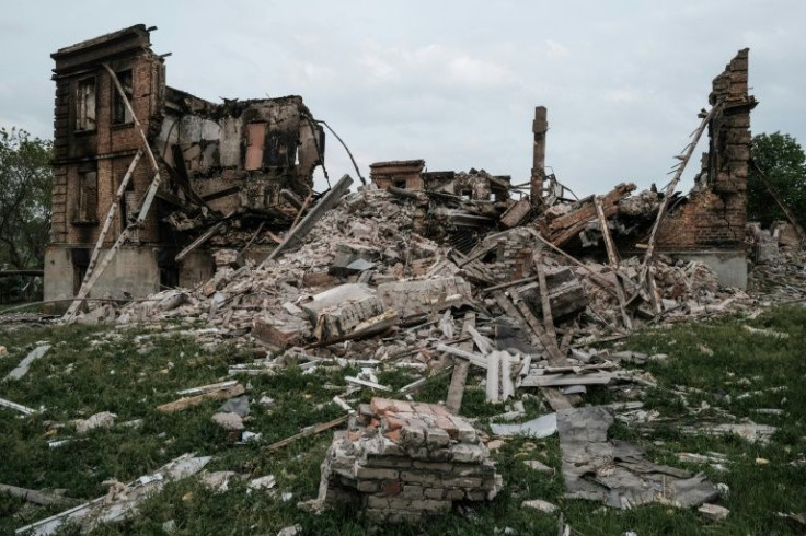 The outlines of a wall are all that remain of a grade school in which Ukraine says 60 sheltering civilians died in a Russian aerial bombing attack