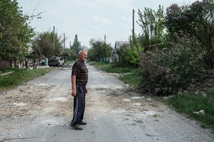 'The world has turned upside down,' Vladimir Gerasimenko said climbing out of his cellar for the first time in seven days