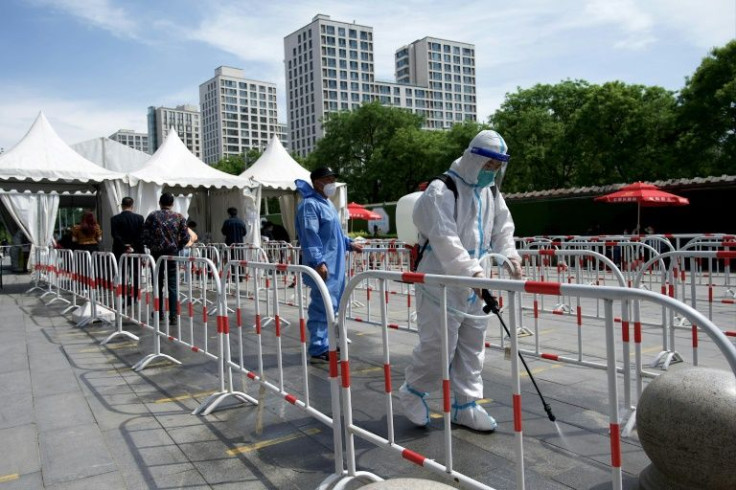 Authorities in China are pursuing a strategy of stamping out the virus entirely, which includes rapid lockdowns and mass testing