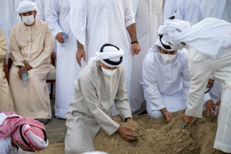 UAE's new ruler Sheikh Mohamed bin Zayed al Nahyan (C) at the funeral in Abu Dhabi of late  President Sheikh Khalifa bin Zayed Al-Nahyan