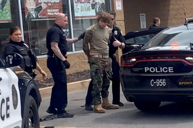 A man is detained following a mass shooting in the parking lot of TOPS supermarket, in a still image from a social media video in Buffalo, New York, U.S. May 14, 2022.  Courtesy of BigDawg/ via REUTERS THIS IMAGE HAS BEEN SUPPLIED BY A THIRD PARTY. MANDAT