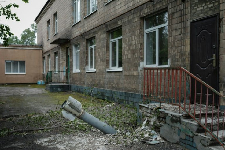An unexploded ordnance is seen at a backdoor of a kindergarten where seven people have been sheltering, in Lysychansk, eastern Ukraine