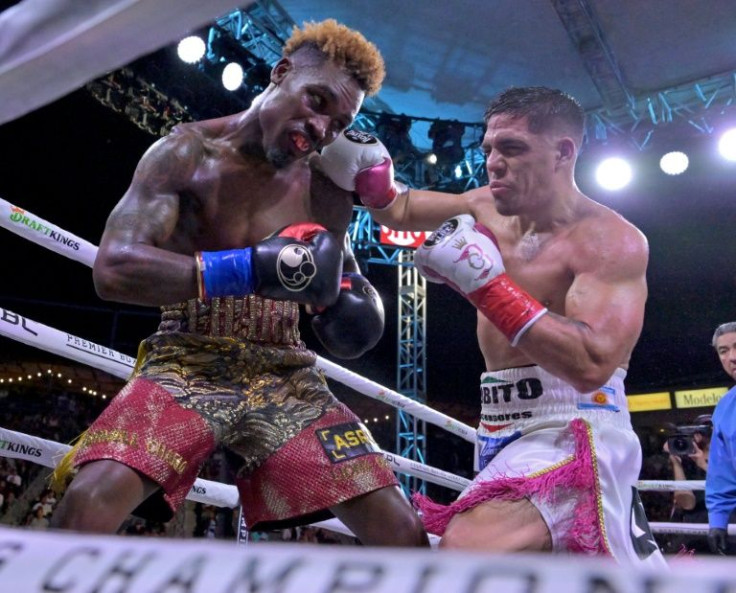 Jermell Charlo (left) trades blows with Argentina's Brian Castano before winning by knockout in their world title fight on Saturday