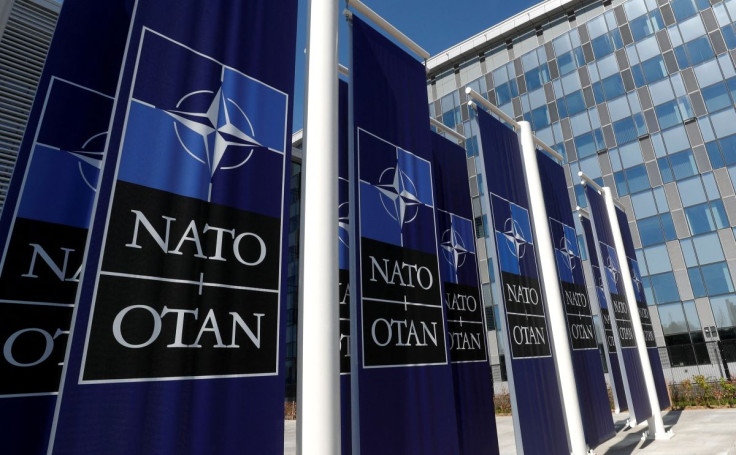 Banners displaying the NATO logo are placed at the entrance of new NATO headquarters during the move to the new building, in Brussels, Belgium April 19, 2018.  
