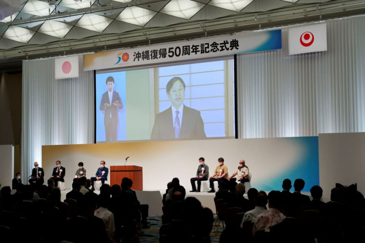 Japan's Emperor Naruhito (on a screen) delivers a speech during the ceremony for the 50th Anniversary of Okinawa's reversion to Japan from U.S. occupation, in Tokyo, Japan, May 15, 2022. Rodrigo Reyes Marin/Pool via REUTERS