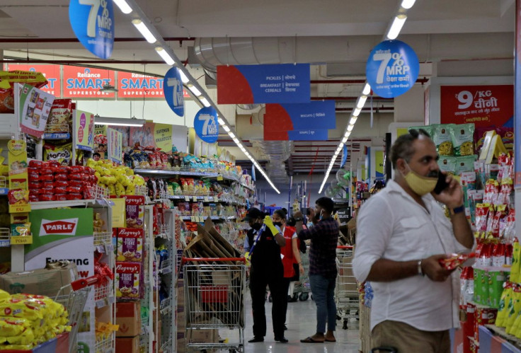 Customers buy grocery items inside a superstore of Reliance Industries Ltd, in Mumbai, India, October 7, 2020. 