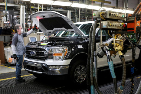 An assembly worker of Ford Motor works on an F-series pickup truck at the Dearborn Truck Plant in Dearborn, Michigan, U.S., January 26, 2022. 