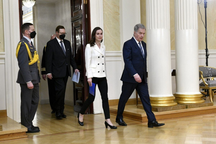 Finland's Prime Minister Sanna Marin and Finland's President Sauli Niinisto arrive to attend a joint news conference on Finland's security policy decisions at the Presidential Palace in Helsinki, Finland, May 15, 2022. Heikki Saukkomaa/ Lehtikuva/via REU