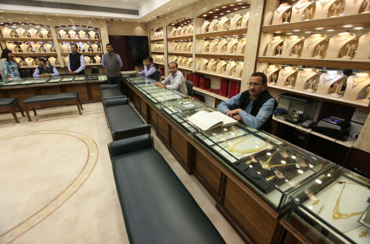 Sales persons wait for customers at a gold jewelry showroom in Chandigarh, India, November 9, 2016. 