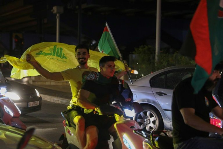 Supporters of Lebanon's Shiite groups Hezbollah and Amal take part in a rally following parliamentary elections in the southern suburb of the capital Beirut