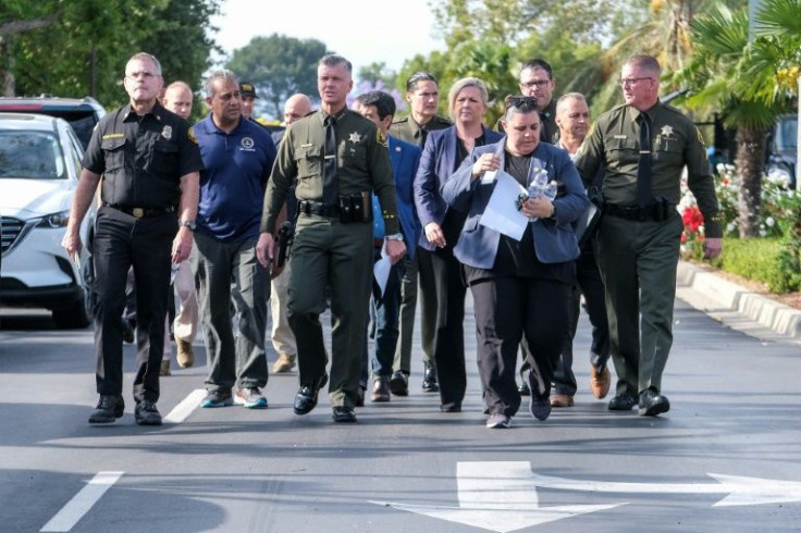 Officials arrive at a press conference after a shooting at a church in Laguna Woods, California on May 15, 2022