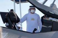Sheikh Hamdan bin Mohammed bin Rashid Al-Maktoum, Crown Prince of Dubai, inspects the open cockpit of an F-35 Lightning II multirole combat aircraft during the 2021 Dubai Airshow in the Gulf emirate on November 14, 2021