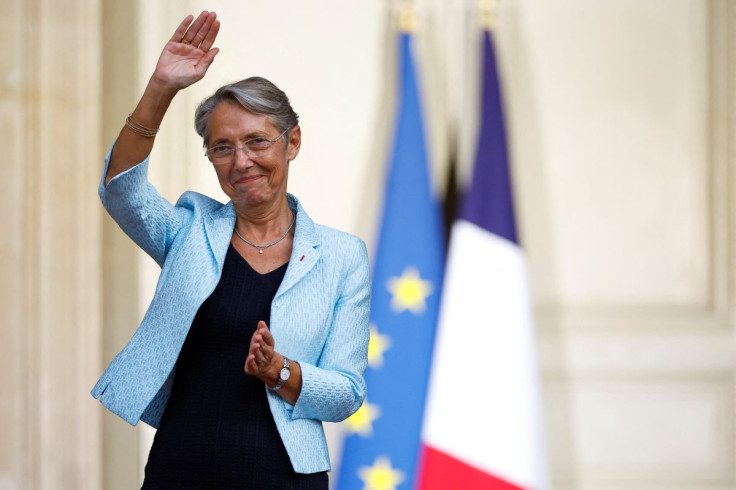 Newly-appointed French Prime Minister Elisabeth Borne gestures as she attends a handover ceremony in the courtyard of Hotel Matignon in Paris, France, May 16, 2022.