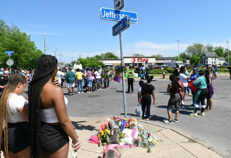 Mourners gather near a Tops Grocery store in Buffalo, New York, on May 15, 2022
