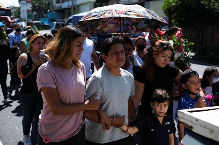 Juan Carlos Galeas walks at the funeral procession for his brother William, who was detained mid-April and sent to La Esperanza prison until authorities handed over William's dead body to the family in mid-May, in San Salvador, El Salvador, May 13, 2022. 