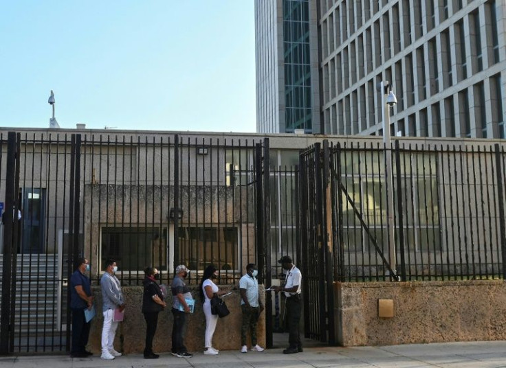 People queue at the US embassy in Havana on May 3, 2022, as the consulate resumed issuing some immigrant visa services which were suspended since 2017 following multiple cases of 'Havana Syndrome'