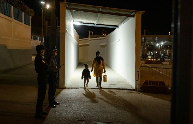 People arrive in Fnideq after the border with the Spanish enclave of Ceuta reopens after two years' closure due to Covid and a diplomatic row