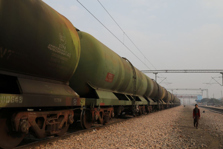 A boy walks past an oil tanker train stationed at a railway station in Ghaziabad, on the outskirts of New Delhi, India, February 1, 2019. 
