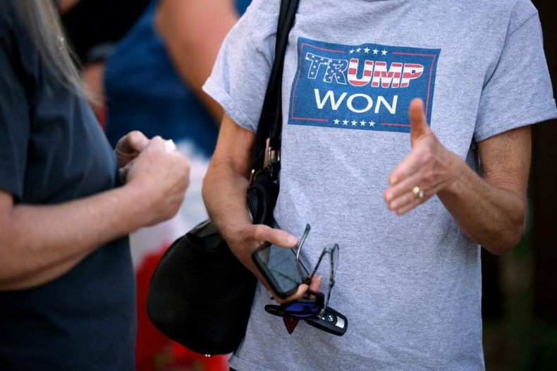 A woman wears a t-shirt falsely claiming that former U.S. President Donald Trump won the 2020 election, after a presentation to the Surry County board of commissioners by several individuals that aimed to cast doubt on election integrity, urging the commi