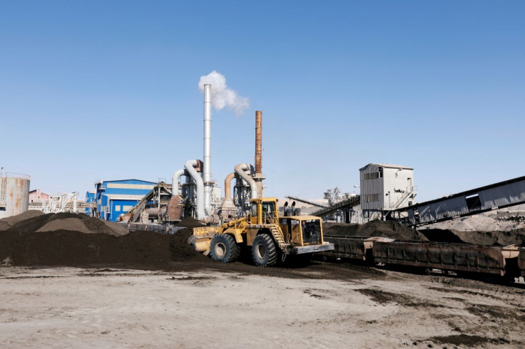 A bulldozer transports a treated phosphate to be put in wagons at a phosphate production plant in Metlaoui, Tunisia February 8, 2019.
