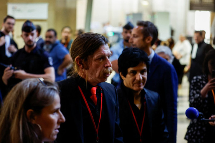 Members of the rock group "Eagles of Death Metal", singer Jesse Hughes and former guitarist Eden Galindo speak to the media as they are at the Paris courthouse for the trial of the Paris' November 2015 attacks on the Ile de la Cite, in Paris, France, May
