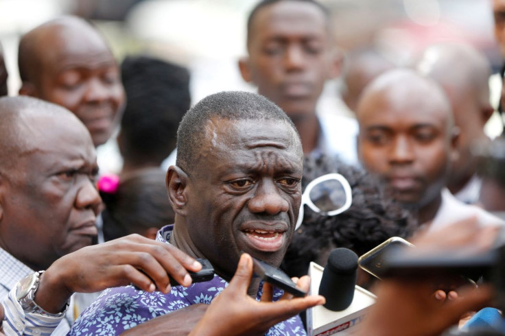 Ugandan opposition leader Kizza Besigye speaks to the media at the high court, in the capital Kampala, where he was charged with treason October 4, 2016. 