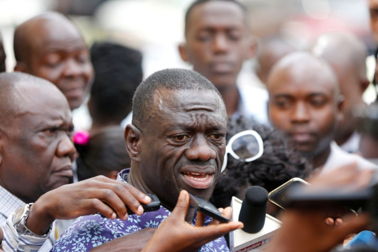 Ugandan opposition leader Kizza Besigye speaks to the media at the high court, in the capital Kampala, where he was charged with treason October 4, 2016.