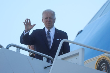 U.S. President Joe Biden waves while boarding Air Force One as he departs Washington on travel to Buffalo, New York in the wake of a weekend shooting at a Buffalo supermarket, at Joint Base Andrews in Maryland, U.S., May 17, 2022. 