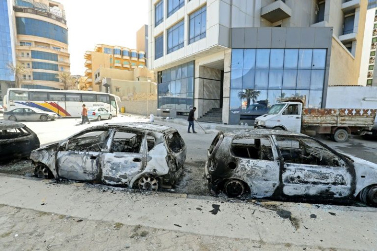 Vehicles in Libya's capital Tripoli were destroyed during fighting between forces loyal to Prime Minister Abdulhamid Dbeibah and rival forces of the Tobruk-based government on May 17, 2022