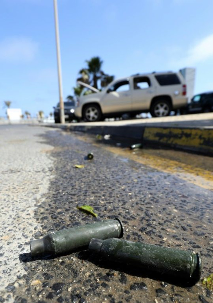 Bullet casings lie on the road after fighting between forces loyal to the Tripoli-based Prime Minister Abdulhamid Dbeibah and rival forces of the Tobruk-based government