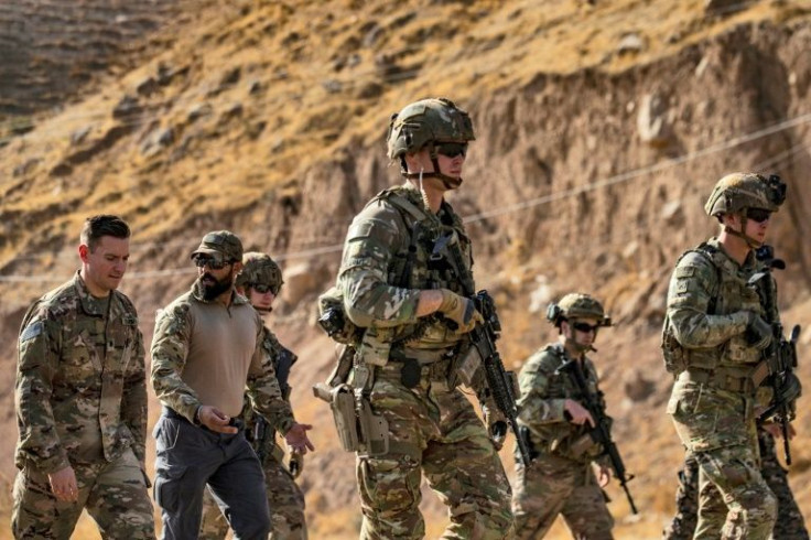 US soldiers patrol an area near Syria's northeastern Semalka border crossing with Iraq's Kurdish autonomous territory, on November 1, 2021