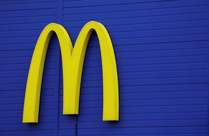 A sign with the logo is on display near a McDonald's restaurant in Moscow, Russia May 16, 2022. 