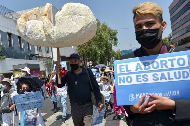 People take part in a march against the legalization of the abortion in Mexico City, on May 7, 2022.