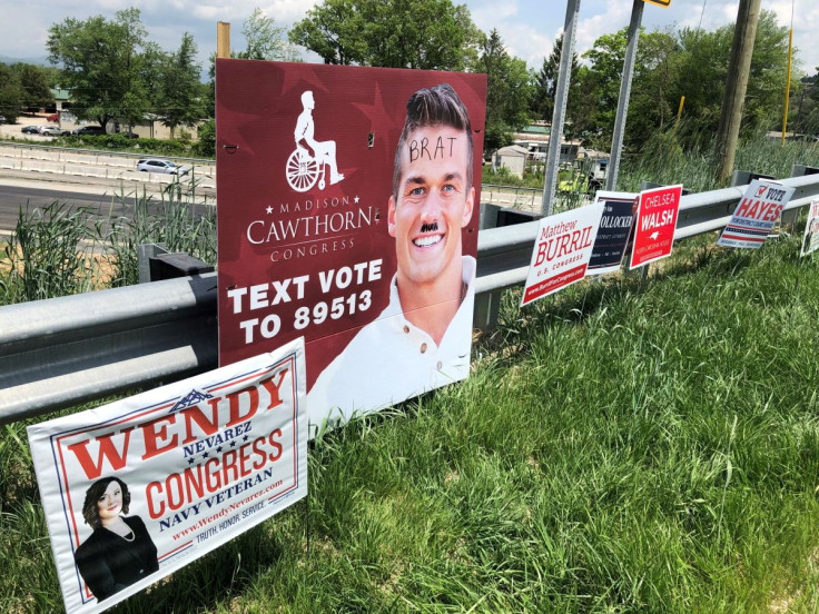 An oversized Madison Cawthorn for Congress poster is seen defaced in northern Henderson County, North Carolina, U.S. May 6, 2022.  John Boyle/USA Today Network via REUTERS 