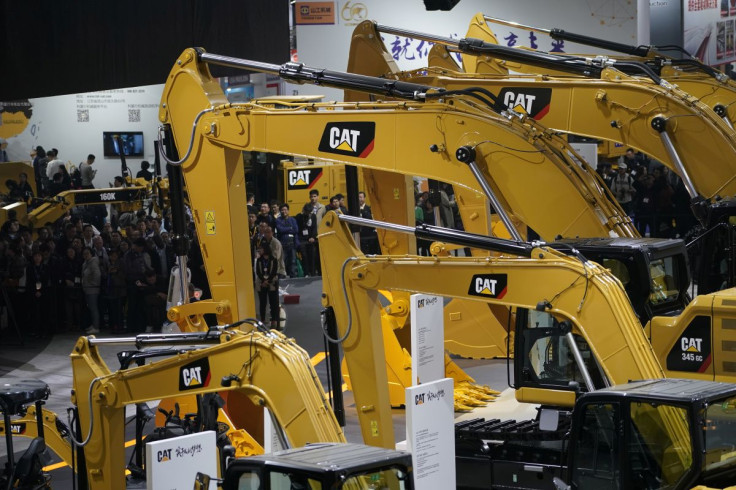 People visit heavy machinery of Caterpillar at Bauma China, the International Trade Fair for Construction Machinery in Shanghai, China November 27, 2018.