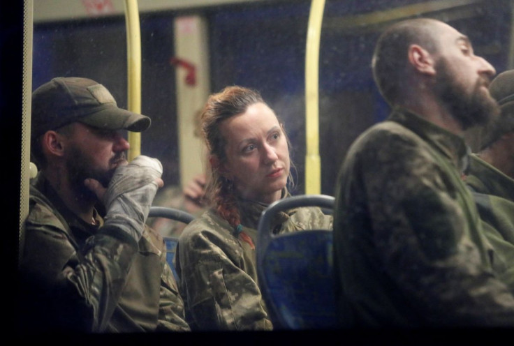 Service members of Ukrainian forces who have surrendered after weeks holed up at Azovstal steel works are seen inside a bus, which arrived under escort of the pro-Russian military at a detention facility in the course of Ukraine-Russia conflict in the set