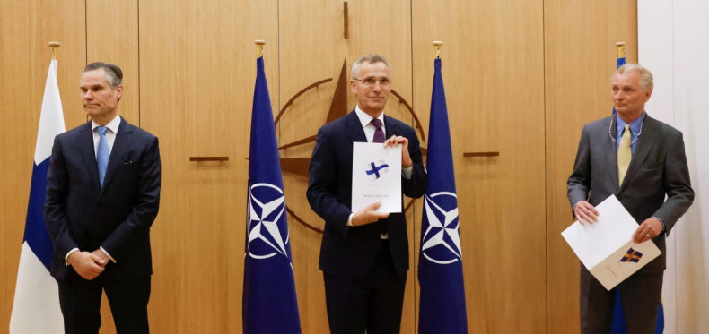 Finland's Ambassador to NATO Klaus Korhonen, NATO Secretary-General Jens Stoltenberg and Sweden's Ambassador to NATO Axel Wernhoff attend a ceremony to mark Sweden's and Finland's application for membership in Brussels, Belgium, May 18, 2022. 